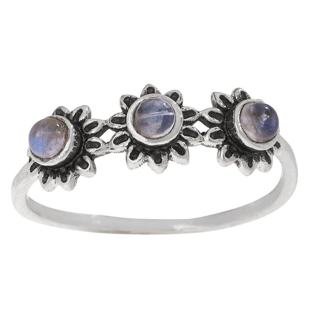 Silver ring with three moonstone stones on a white background