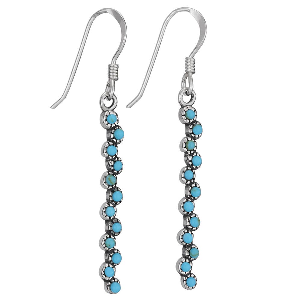 Silver earrings with turquoise beads on a white background