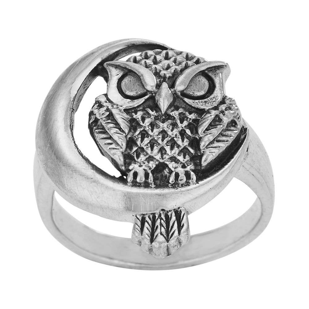Silver owl ring on a white background