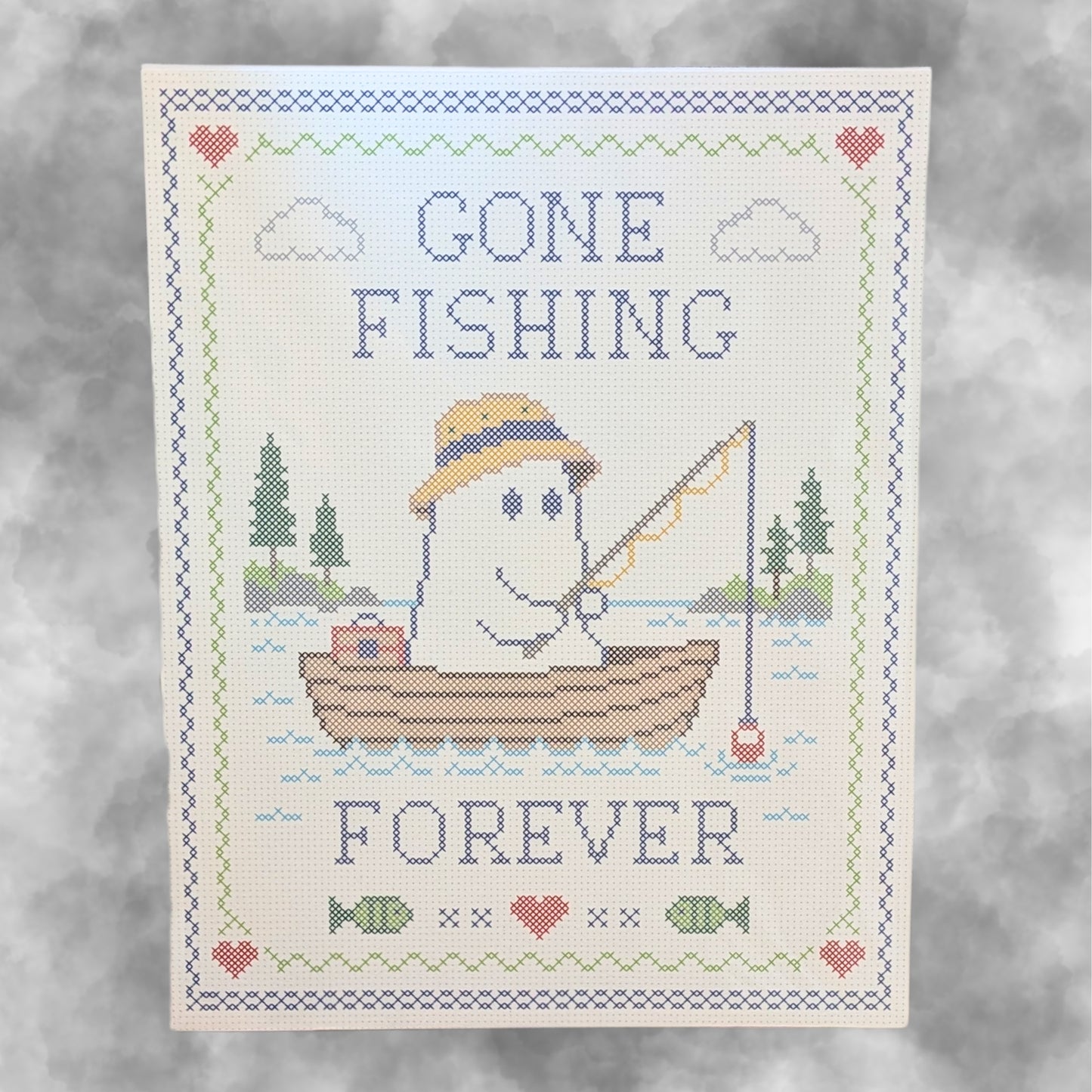 An art print of a ghost fishing in a boat on a lake with the text 'Gone Fishing Forever' on a smokey grey background
