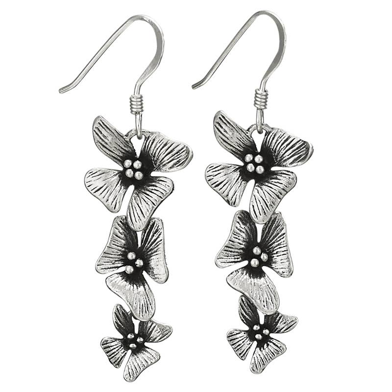 Silver floral earrings on a white background