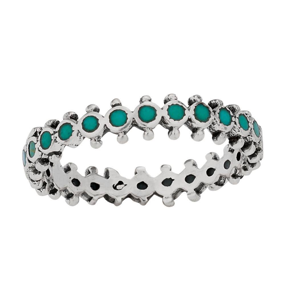 Sterling Silver ring with Turquoise gemstones on a white background