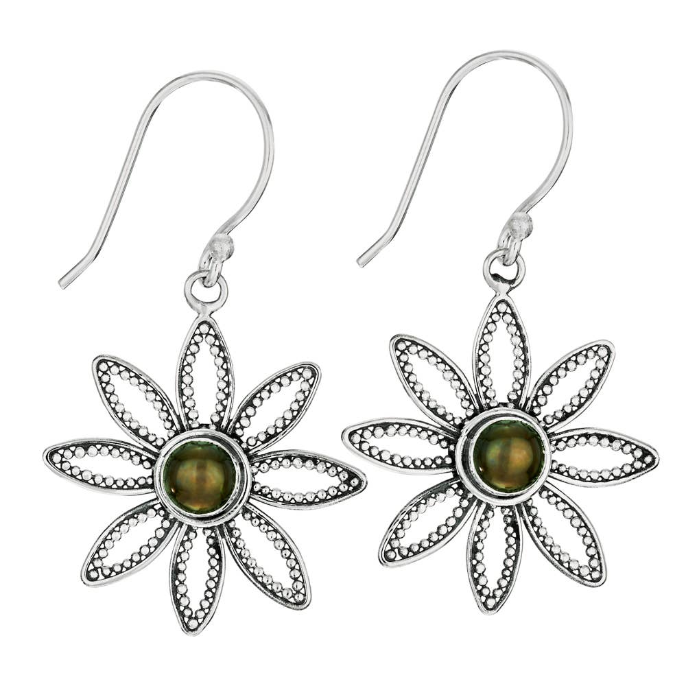 Floral silver earrings with green gemstones on a white background
