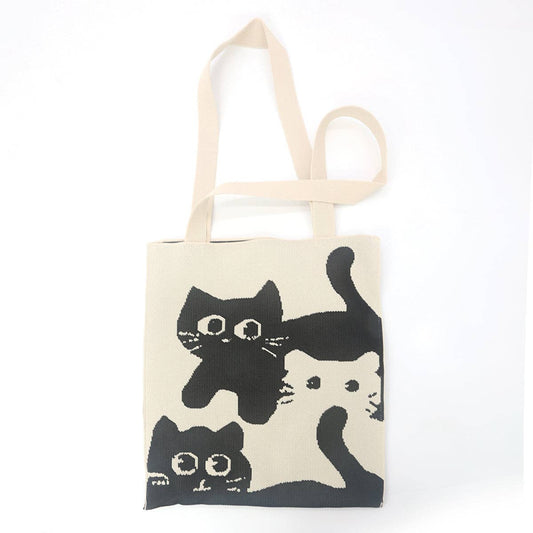 Tote bag with black cat illustrations on a white background