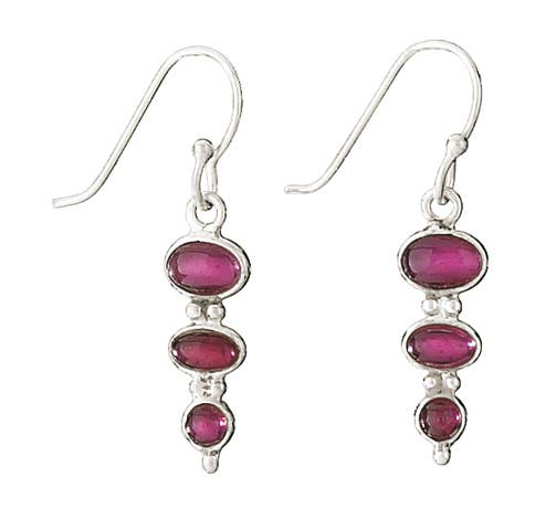 Silver earrings with pink gemstones on a white background