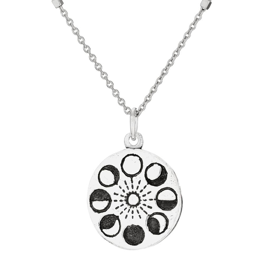 Silver necklace with a circular pendant featuring moon phases on a white background