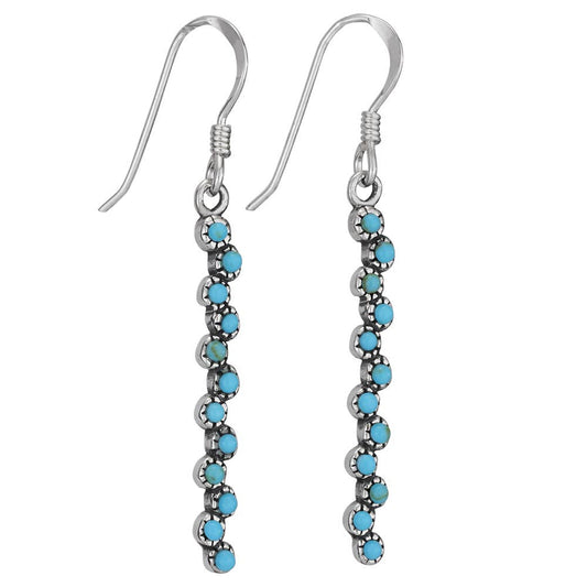 Silver earrings with turquoise beads on a white background