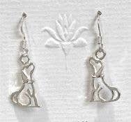 Silver dog-shaped earrings on a white background