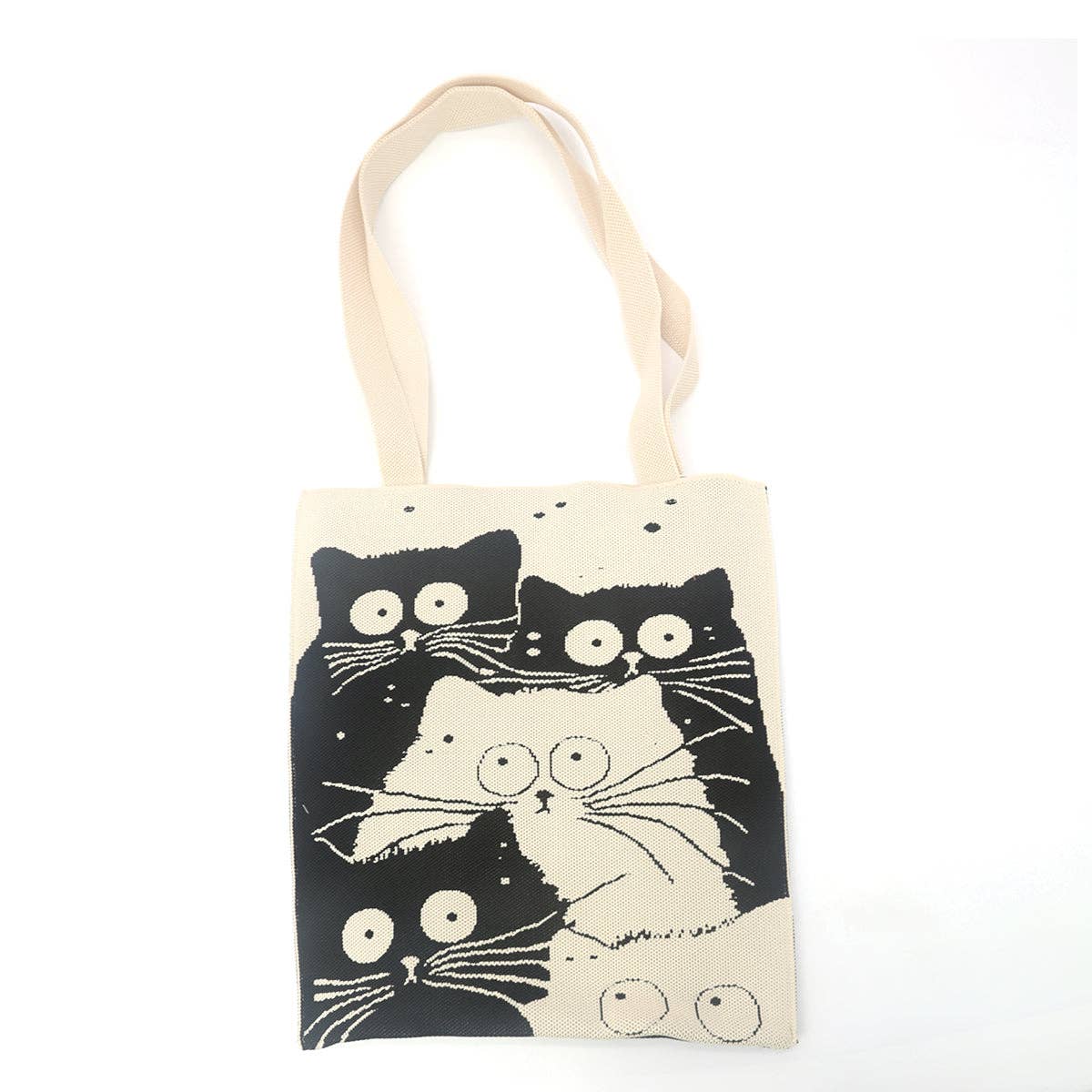 Tote bag with black and white cat illustrations on a beige background
