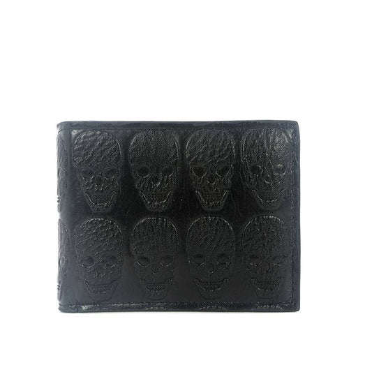 Black wallet with embossed skull designs on a white background