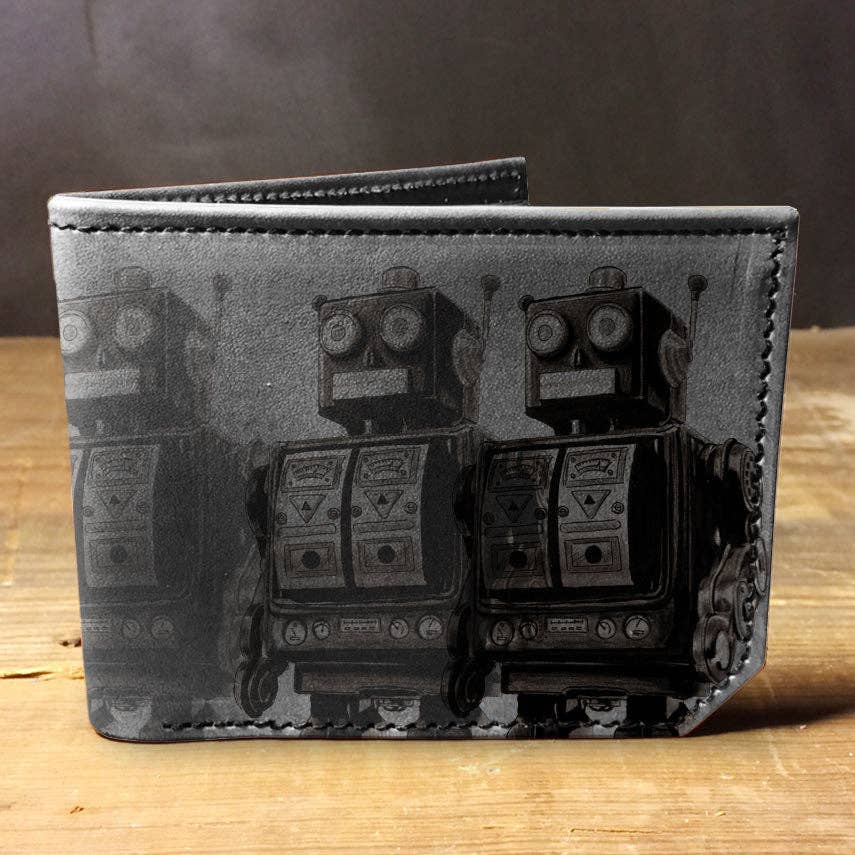 Wallet with robot design on a wooden surface