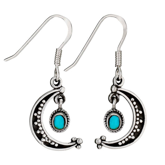 Silver earrings with turquoise stones on a white background