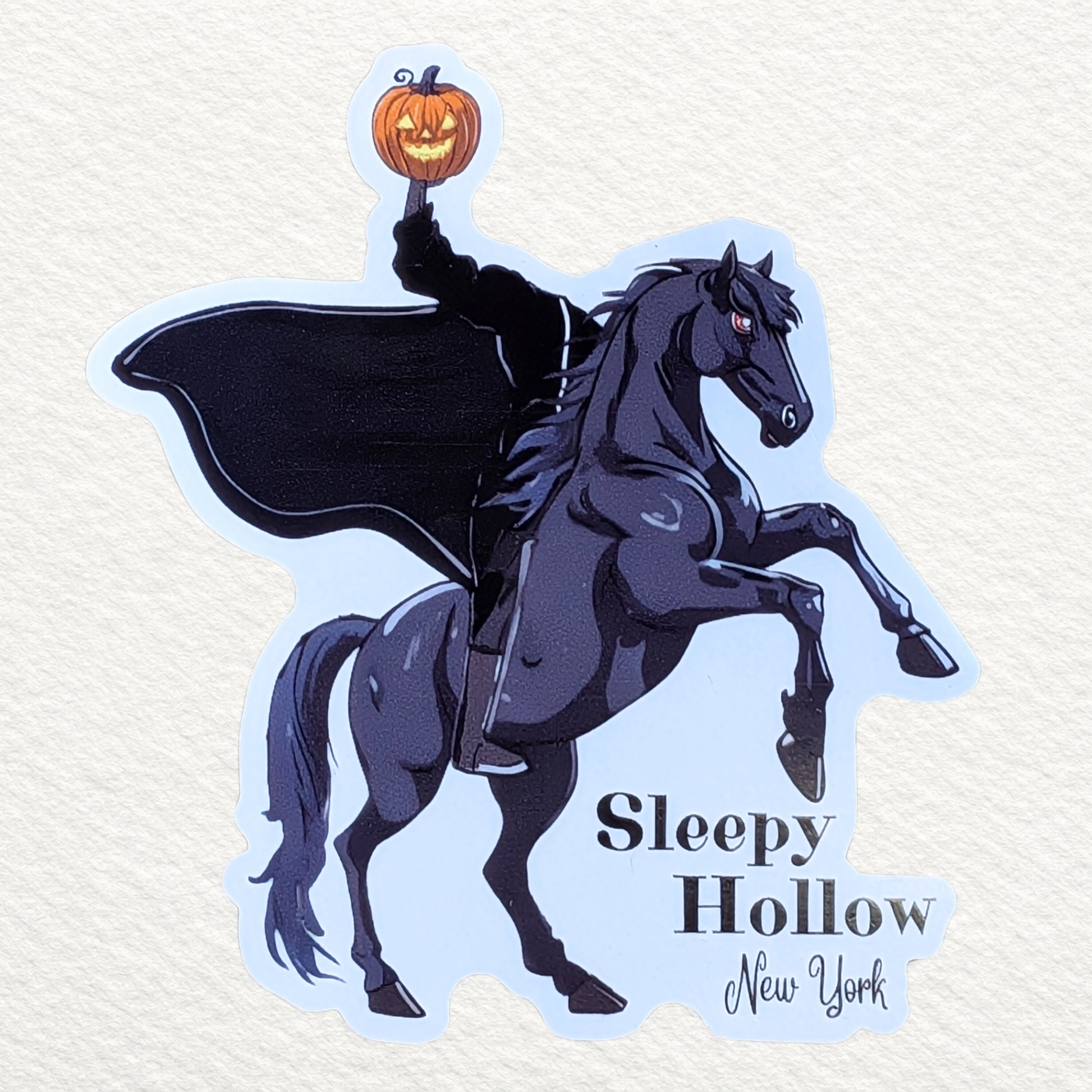 A magnet design featuring the Sleepy Hollow Headless Horseman holding a Jack O-lantern, mounted on a black horse, with the text 'Sleepy Hollow New York' at the bottom.
