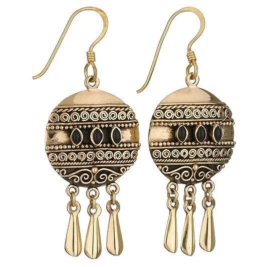 Pair of bronze earrings with intricate designs on a white background