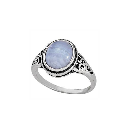 Silver ring with a blue gemstone on a white background