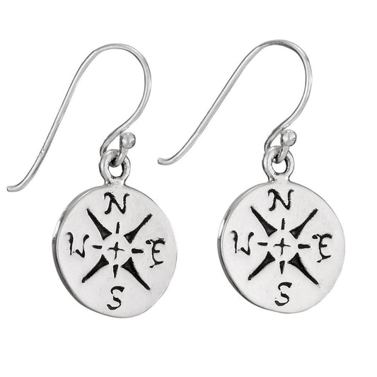 Silver earrings with compass designs on a white background