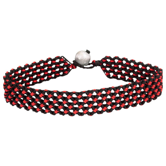 Red and black braided bracelet with a silver clasp on a white background