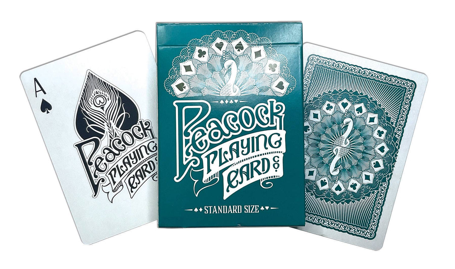 Teal deck of Peacock playing cards with an Ace of Spades showing.