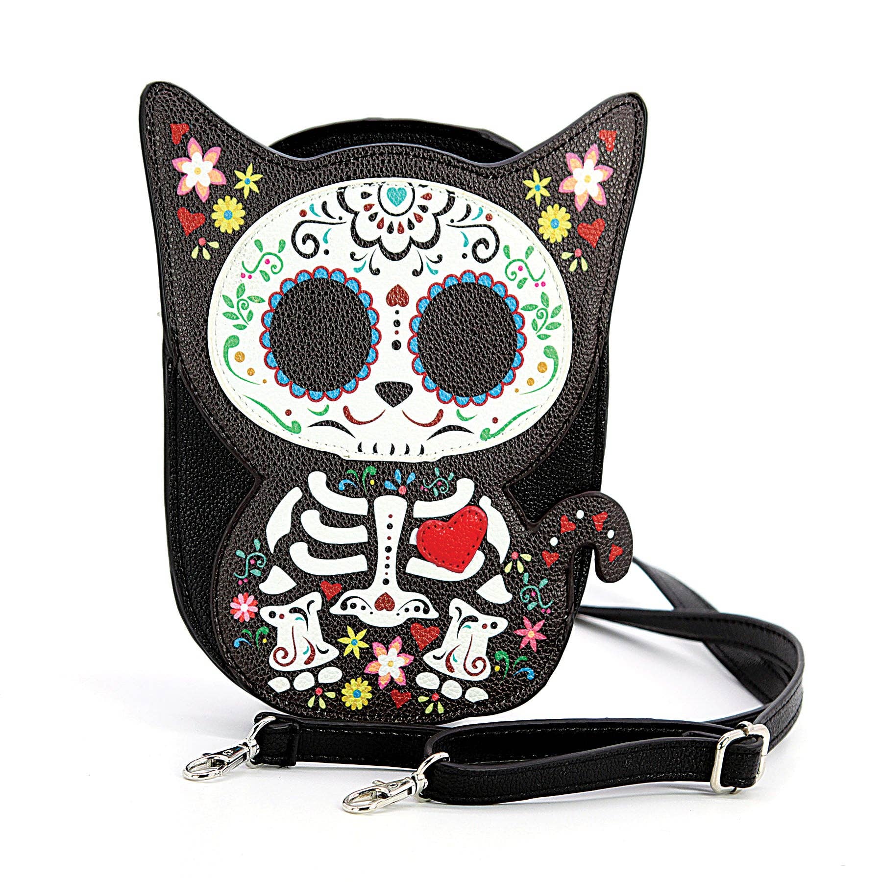 Black faux-leather cat-shaped crossbody bag with a Day of the Dead sugar skull design, floral accents, and a detachable black shoulder strap on a white background.