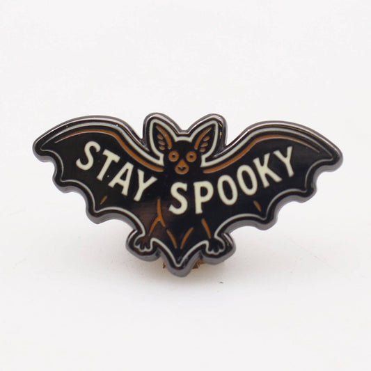 Bat-shaped pin with 'Stay Spooky' text on a white background