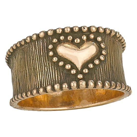 Bronze ring with a heart design on a white background