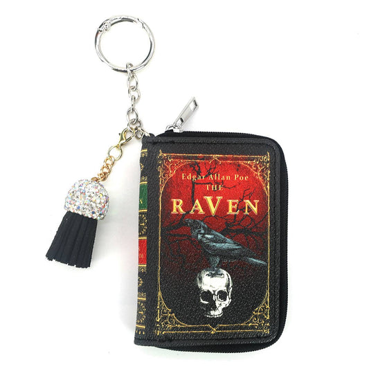 Keychain with 'The Raven' book design featuring an image of a raven on a skull on a white background
