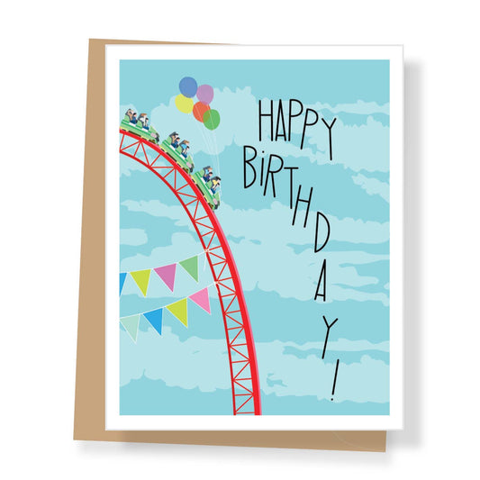 Birthday card with roller coaster illustration and 'Happy Birthday!' text against a blue sky.