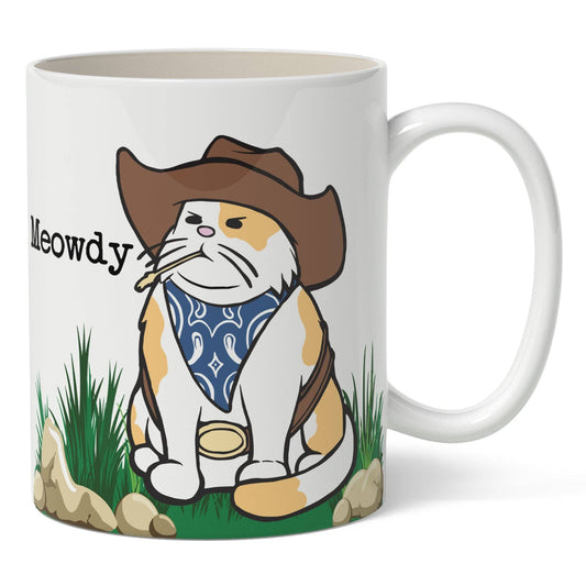 Mug with a cartoon cat in a cowboy hat and bandana design, featuring the word 'Meowdy'.