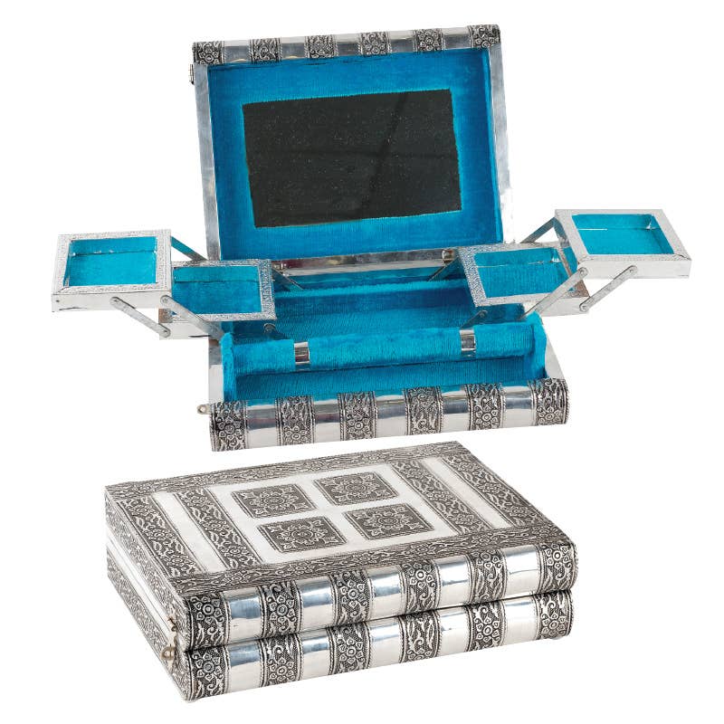 Decorative tin jewelry box with blue interior and silver and black exterior design.