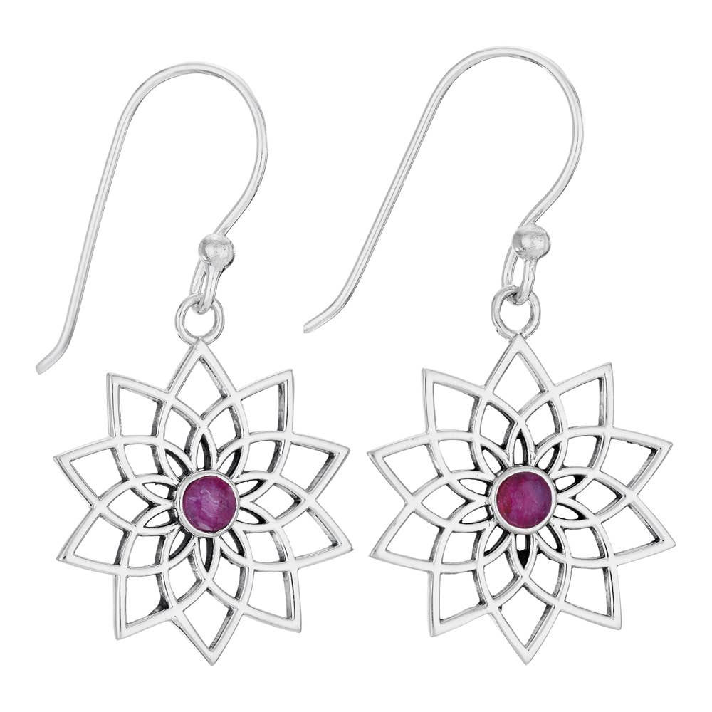 Silver earrings with floral design and purple gemstones on a white background