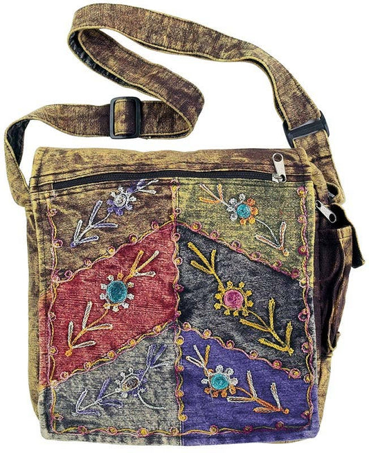 Multicolored stonewashed floral embroidered bag with a strap on a white background