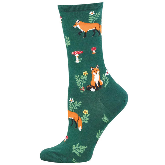Green sock with fox and mushroom pattern on a white background