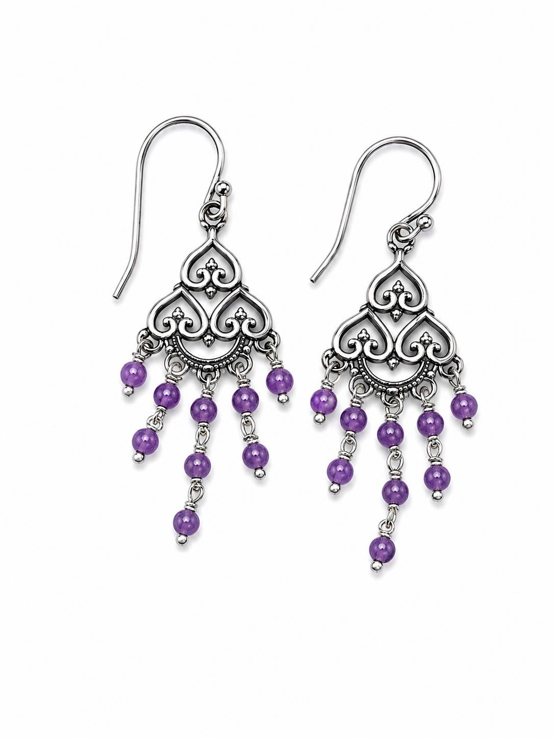 A pair of silver-toned filigree dangle earrings with dangling purple beads, shown on a plain white background.