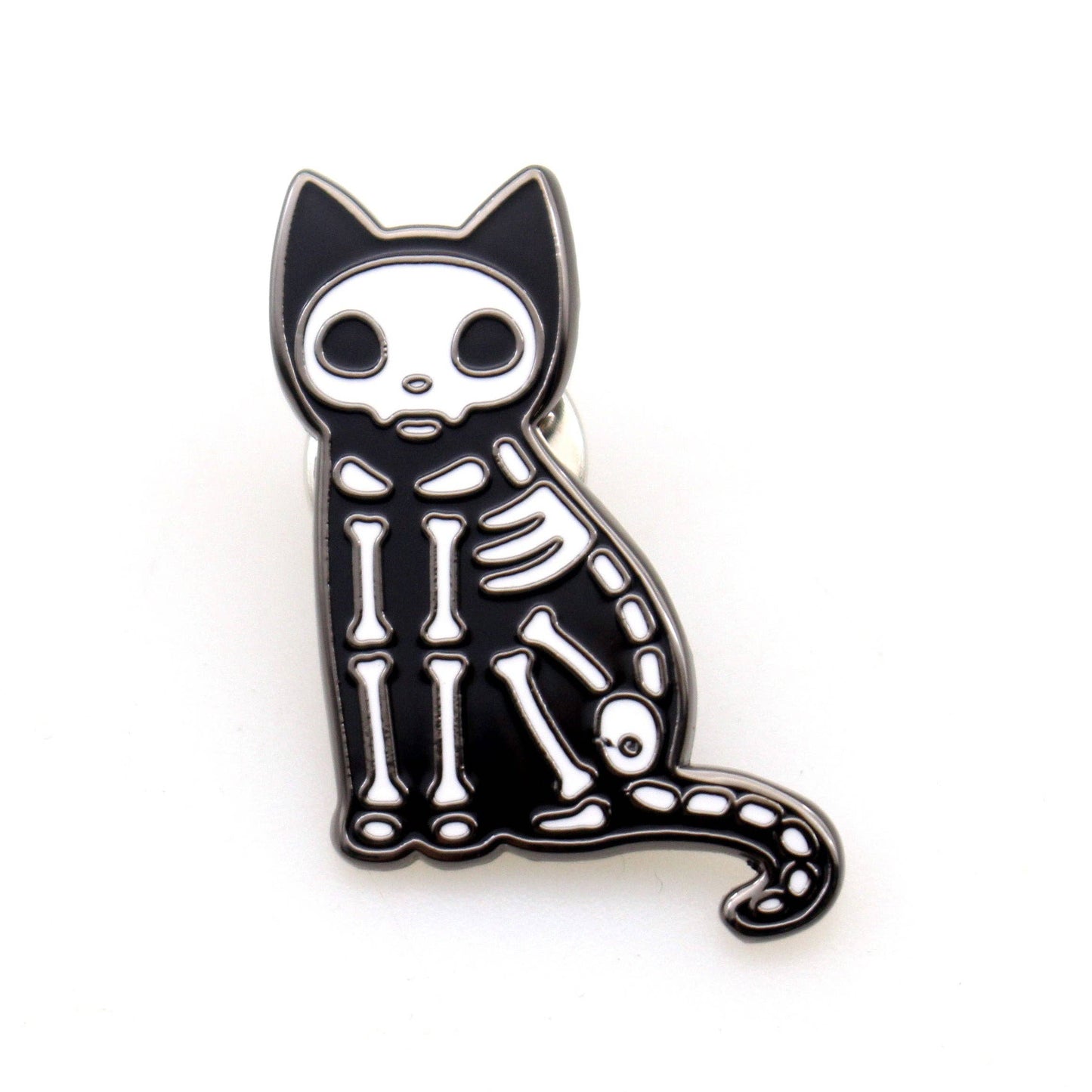 Skeletal cat pin on a white background