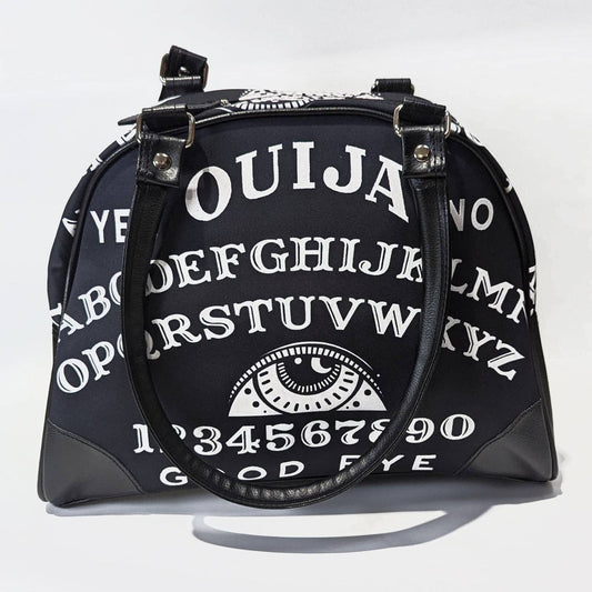 Black handbag with Ouija board design on a white background