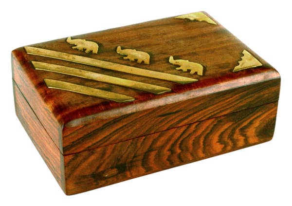 Wooden box with gold accents and elephant carvings on a white background