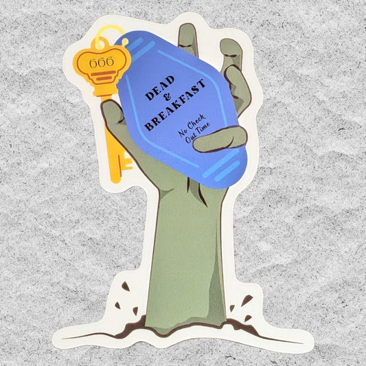 A die-cut sticker featuring a cartoon zombie hand holding a blue keychain that reads 'DEAD OR BREAKFAST No Check Out Time' and a gold key, shown on a textured gray background.