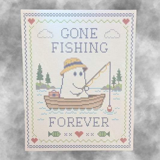 An art print of a ghost fishing in a boat on a lake with the text 'Gone Fishing Forever' on a smokey grey background
