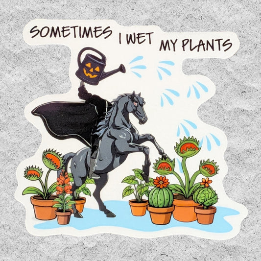 A die-cut sticker featuring a humorous Halloween illustration with the text 'SOMETIMES I WET MY PLANTS'. The design shows the Headless Horseman in a flowing black cape riding a gray horse, holding a glowing jack-o'-lantern, watering can, and pouring water on Venus Flytraps