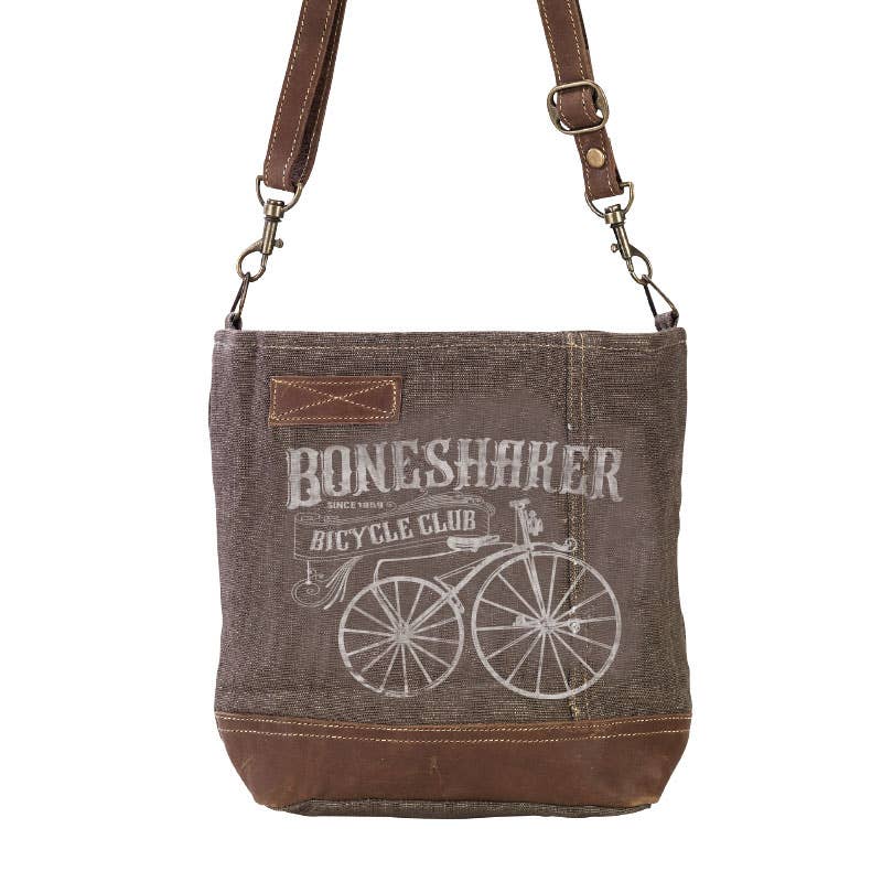 Brown denim bag with 'Boneshaker Bicycle Club' text and bicycle graphic on a white background