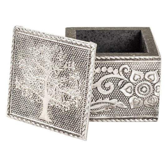 Decorative silver box with intricate tree and floral designs on a white background
