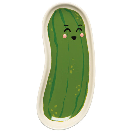 Green pickle shaped dish with a smiling face on a white background