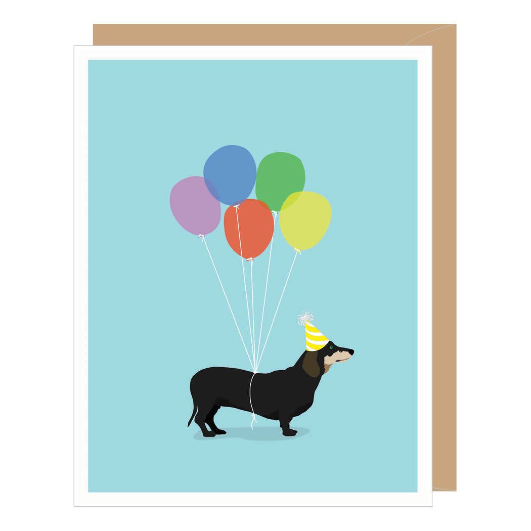 Greeting card with a dachshund holding colorful balloons on a light blue background.