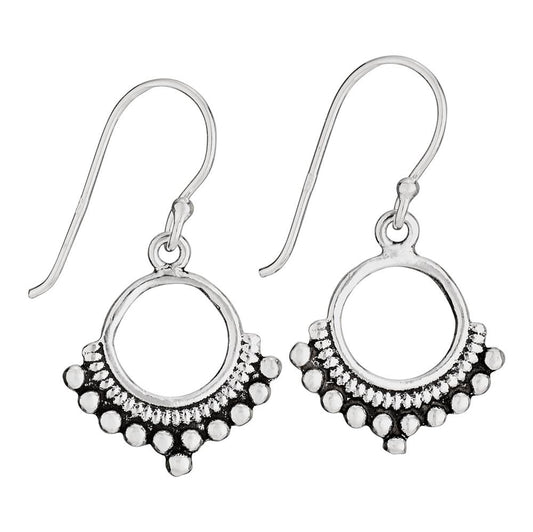Silver hoop earrings with circular designs on a white background
