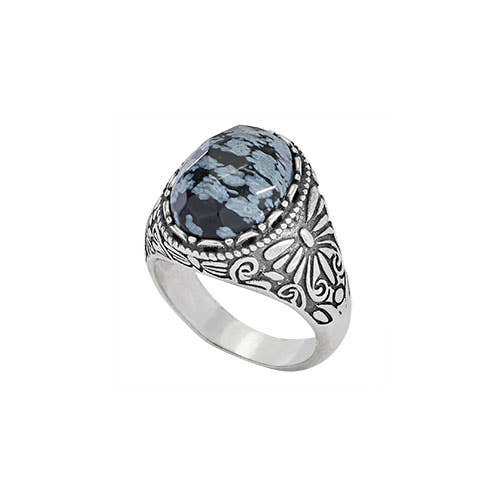 Silver ring with shades of blue stone on a white background