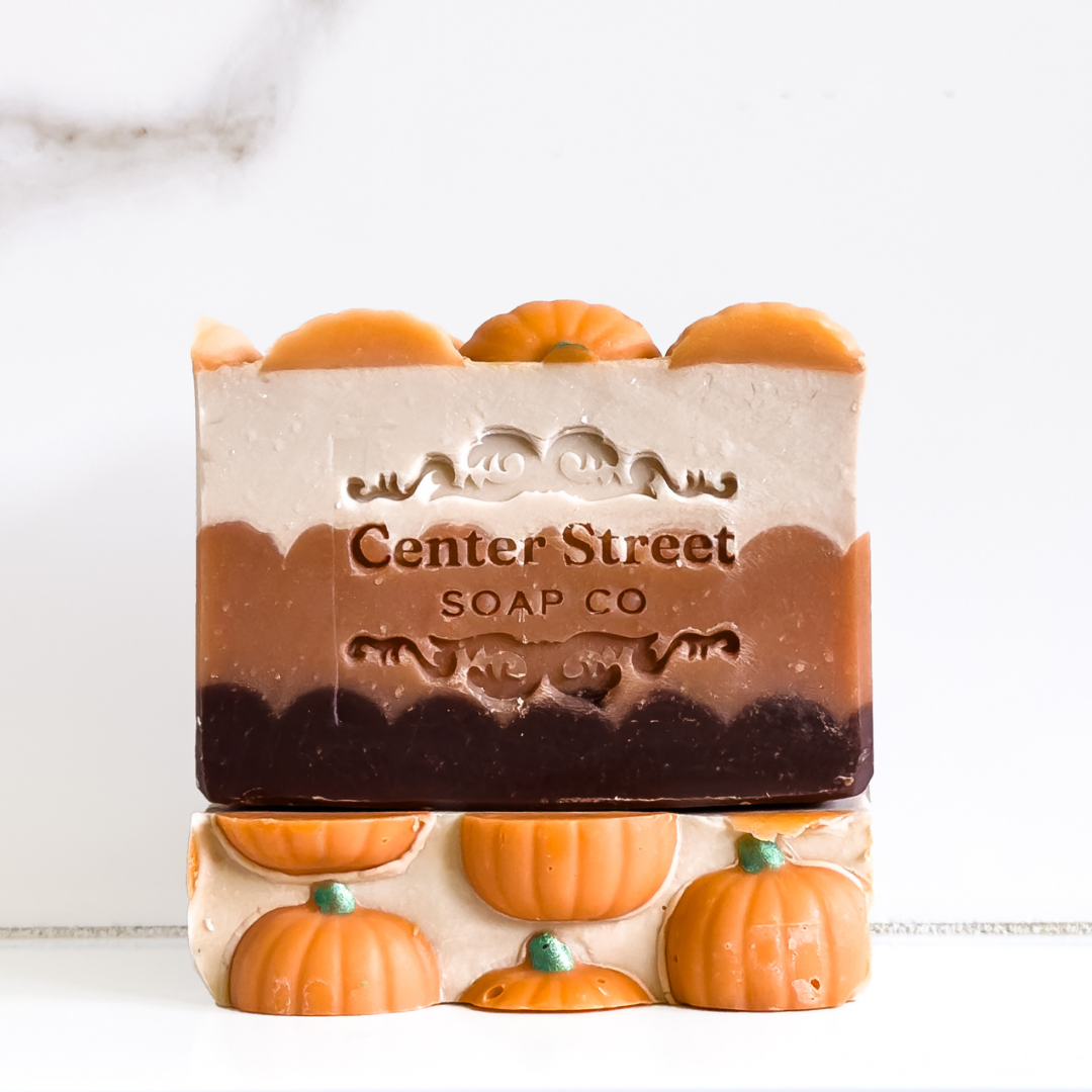 Bar of soap with pumpkin design and 'Center Street Soap Co' branding on a white background