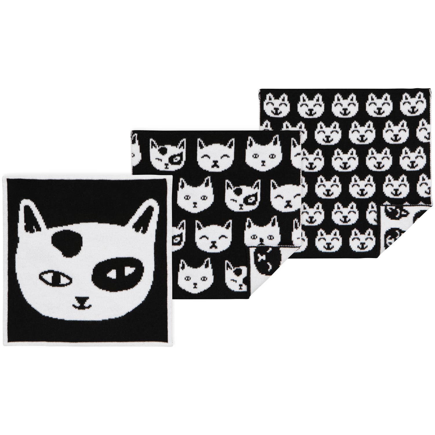 Set of dish towels with black and white cat patterns on a white background
