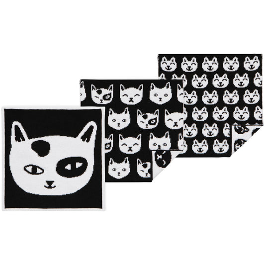 Set of dish towels with black and white cat patterns on a white background