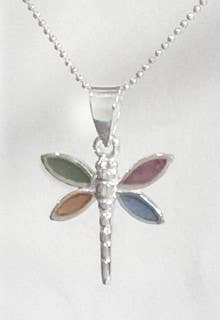 Dragonfly-shaped pendant on a chain against a white background