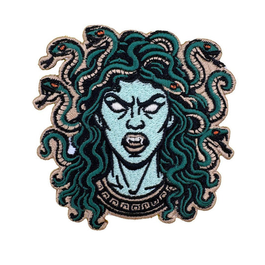 Embroidered patch of a Medusa character with snake hair on a white background